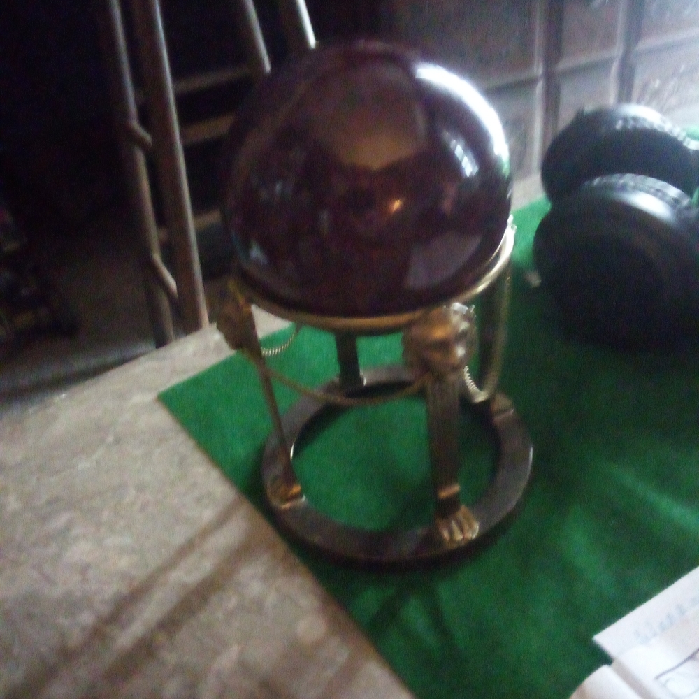 Ceramic sphere in a brass stand